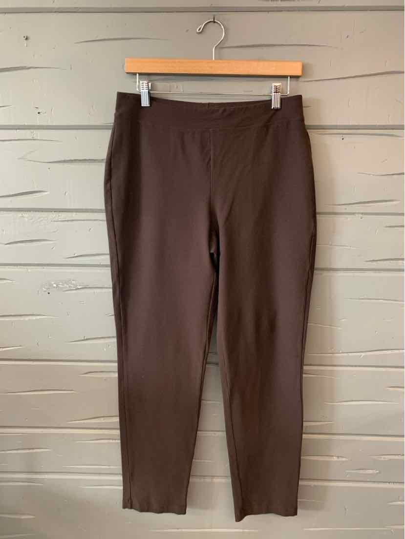 Dark brown slim-fit ankle-length pants with a smooth finish hanging on a wooden hanger.