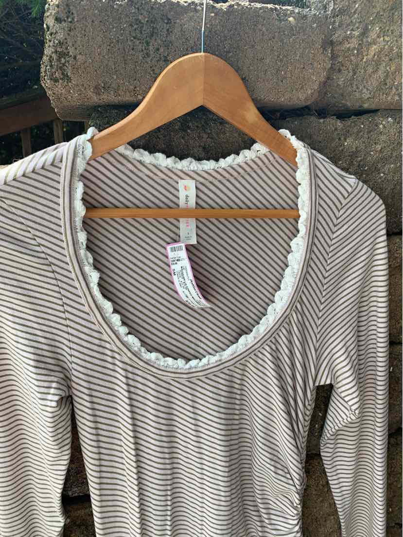 Mauve and white thin striped long-sleeve top with scalloped neckline trim on wooden hanger.