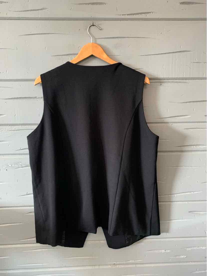 Black sleeveless vest with a tailored fit, smooth fabric, and a slight flare at the hem.