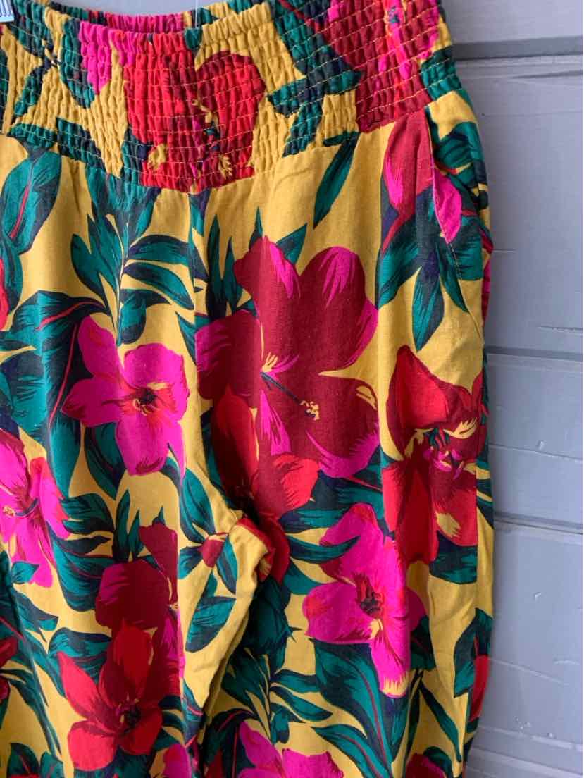 Yellow floral skirt with pink and red flowers and green leaves, elastic waistband, size large.