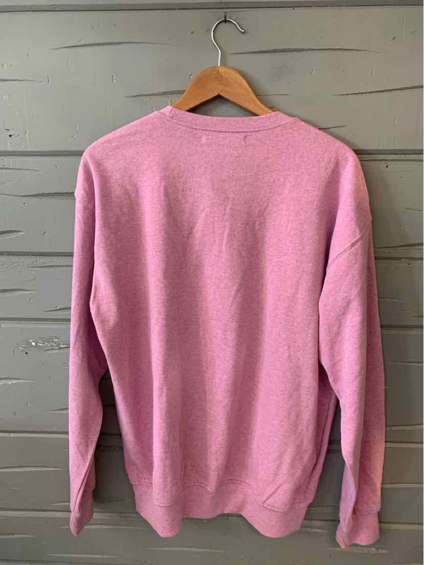 Lavender long-sleeve crewneck sweatshirt with soft fabric, displayed on wooden hanger.