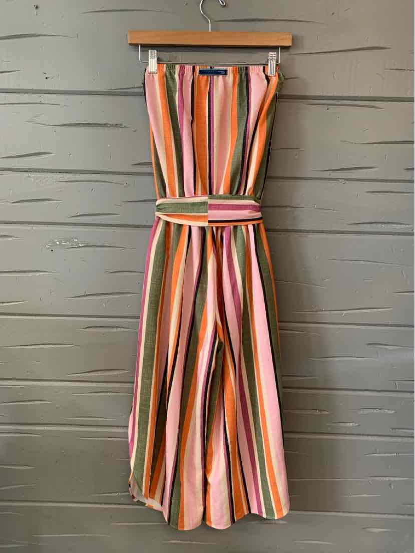 Sleeveless striped jumpsuit in shades of pink, orange, green, and white with a belted waist and wide legs.