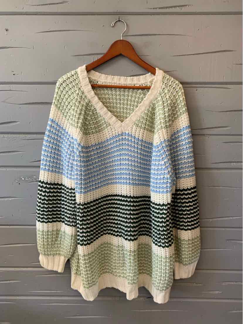 Women’s loose-knit sweater with cream, blue, and black horizontal stripes, V-neck, and long sleeves.