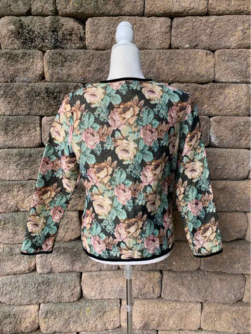 Women's floral blazer with a multicolor botanical print, black background, and notched lapels.