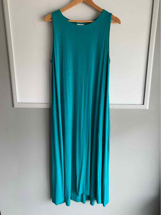 Sleeveless teal maxi dress with scoop neckline hanging on wooden hanger.