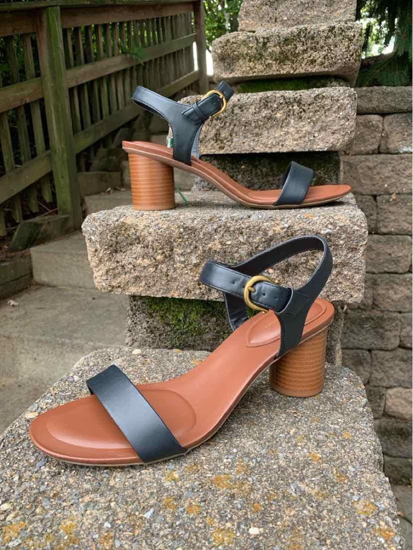 Black leather ankle-strap sandals with tan cushioned footbed and stacked wooden block heel, size 11.