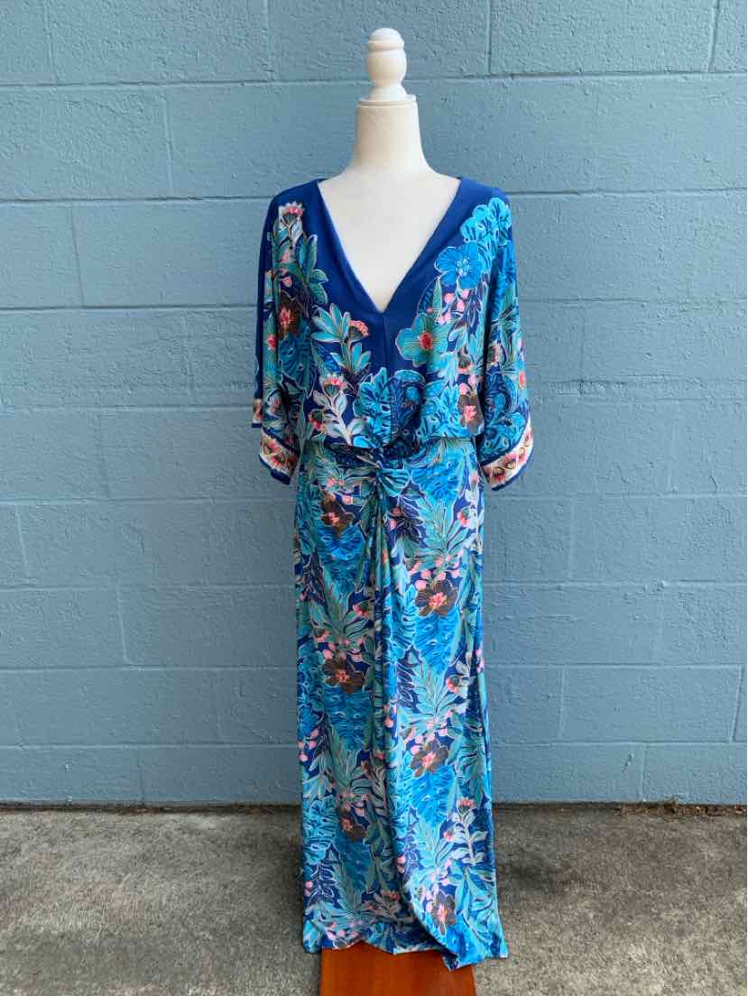 Blue floral wrap dress with V-neck, elbow-length sleeves, and tie waist detail.