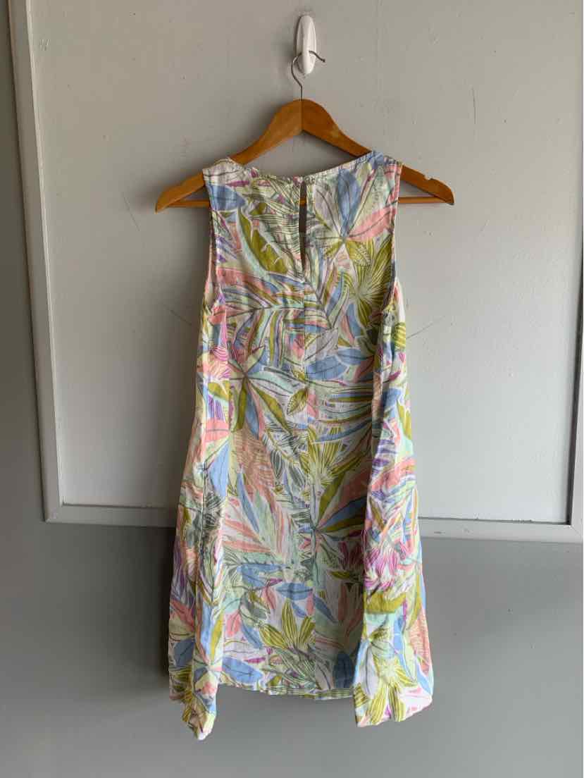 Sleeveless A-line dress with multicolor floral print in pastel shades, knee-length, lightweight fabric.