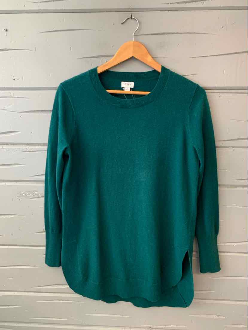 Dark green lightweight knit long-sleeve sweater with crew neckline on wooden hanger.