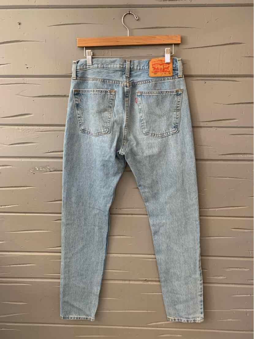 Light blue denim Levi's jeans in size 12.5 with a classic straight fit and orange leather brand patch on the back waistband.