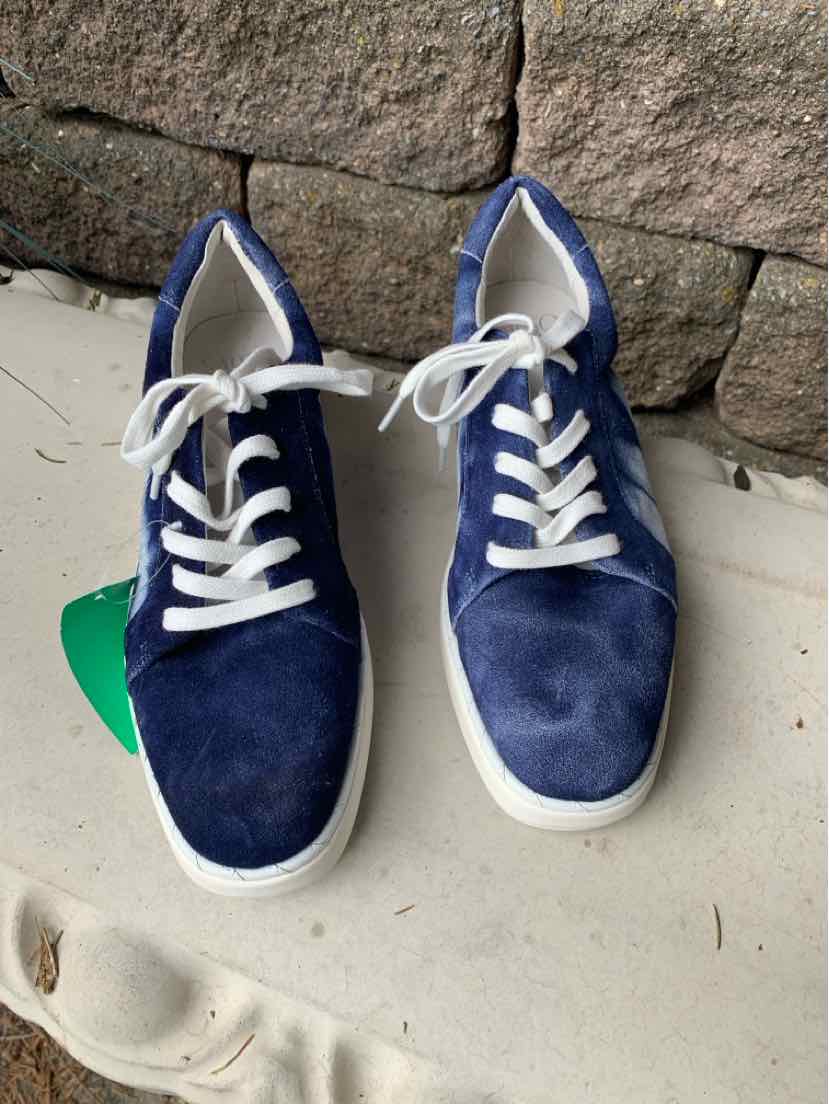 Navy blue suede sneakers with white laces and thick white soles, size 7.5.