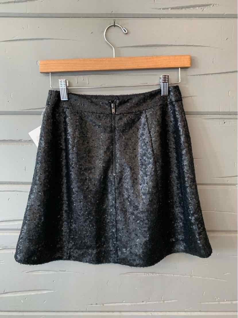 Black sequin mini skirt with slight flare and back zipper closure in size XS.