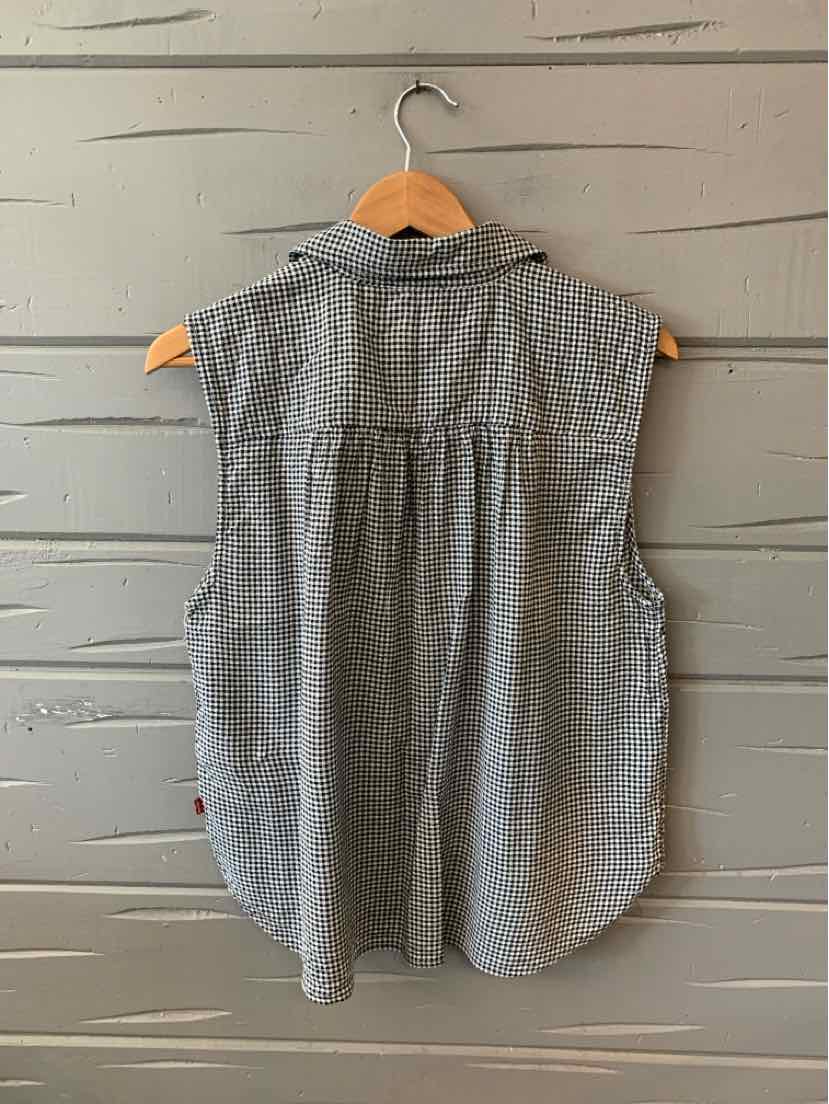 Sleeveless black and white gingham button-up shirt with gathered back yoke, hanging on wooden hanger.