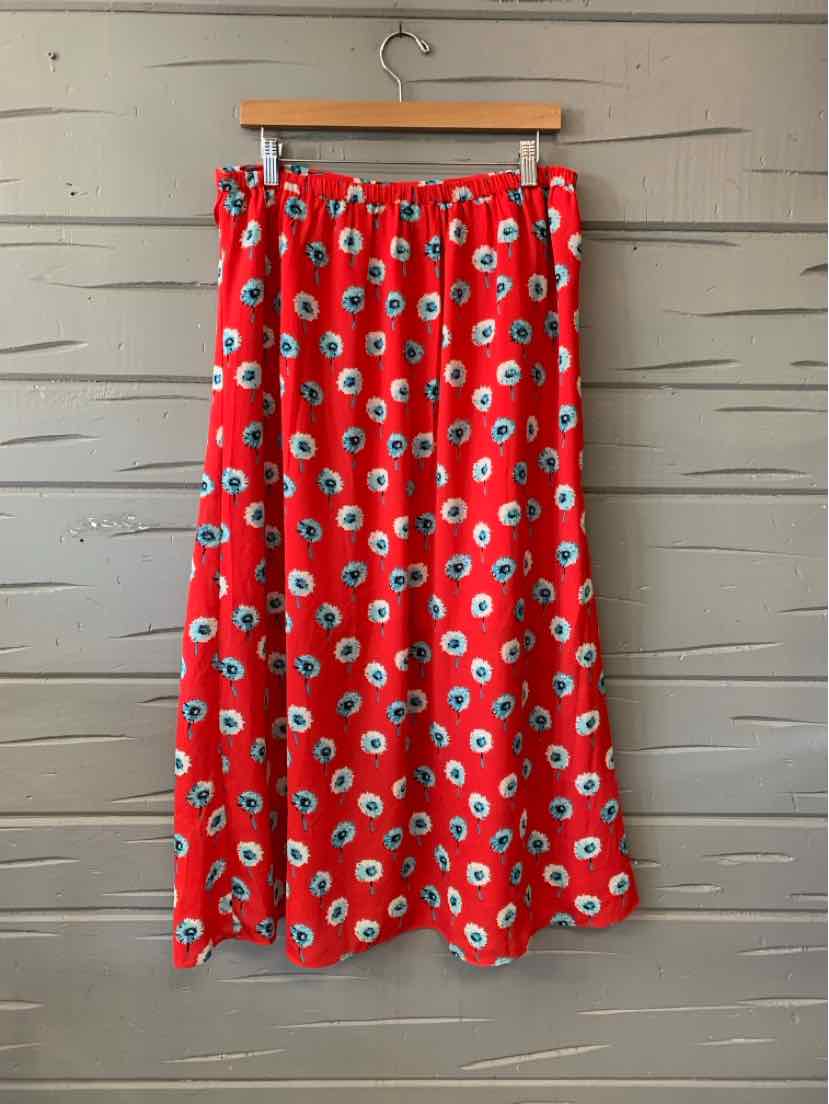 Red midi skirt with white and blue floral print and an elastic waistband.