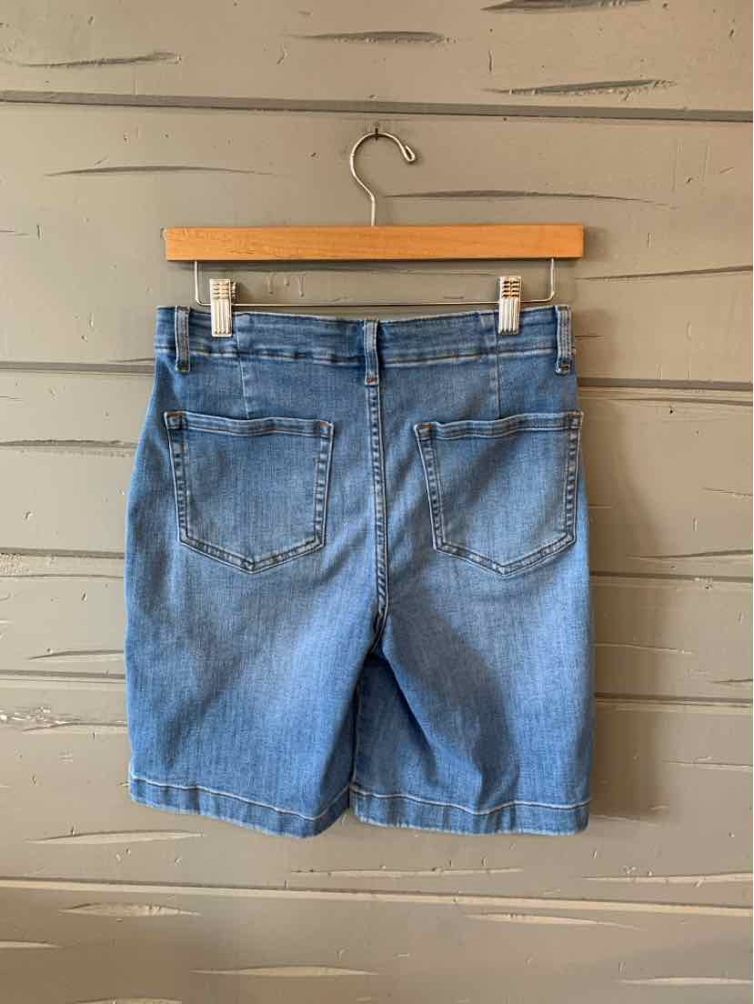 Light blue denim shorts with back pockets and a leather brand patch on the waistband.