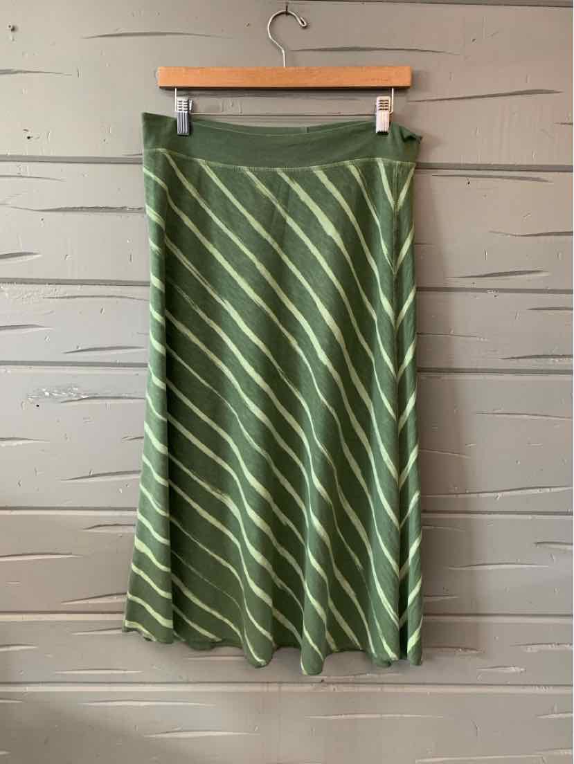 Green midi skirt with diagonal light green stripes and a smooth waistband hanging on wooden hanger.