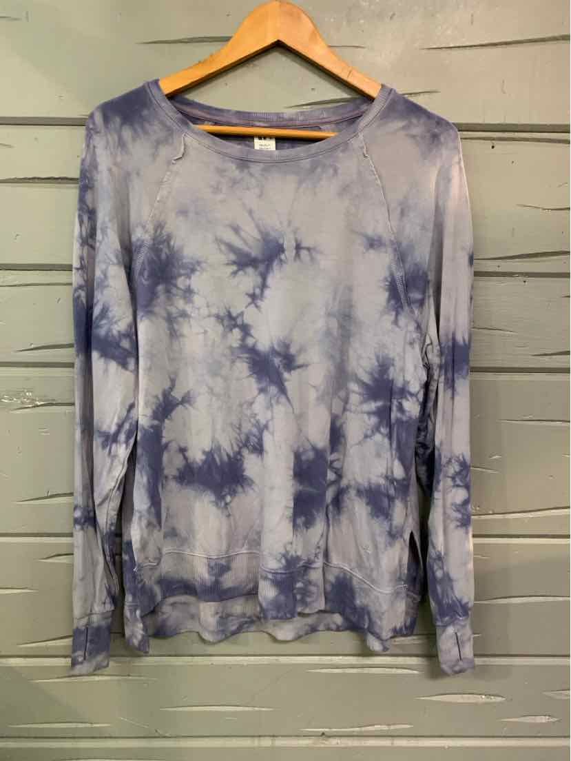 Long-sleeve crewneck shirt with blue and white tie-dye pattern, relaxed fit.