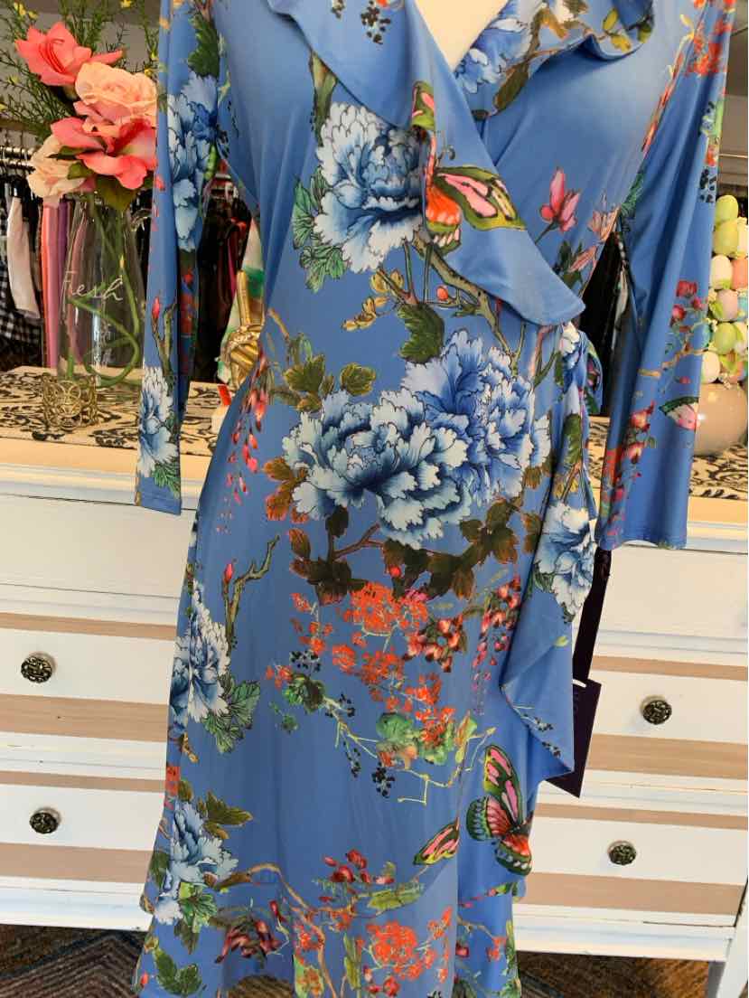 Blue floral wrap dress with ruffled neckline and three-quarter sleeves in size small.