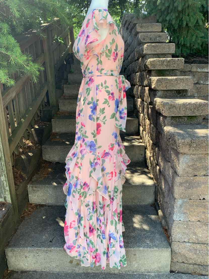 Pink floral sleeveless maxi dress with tiered ruffles and fitted waist.