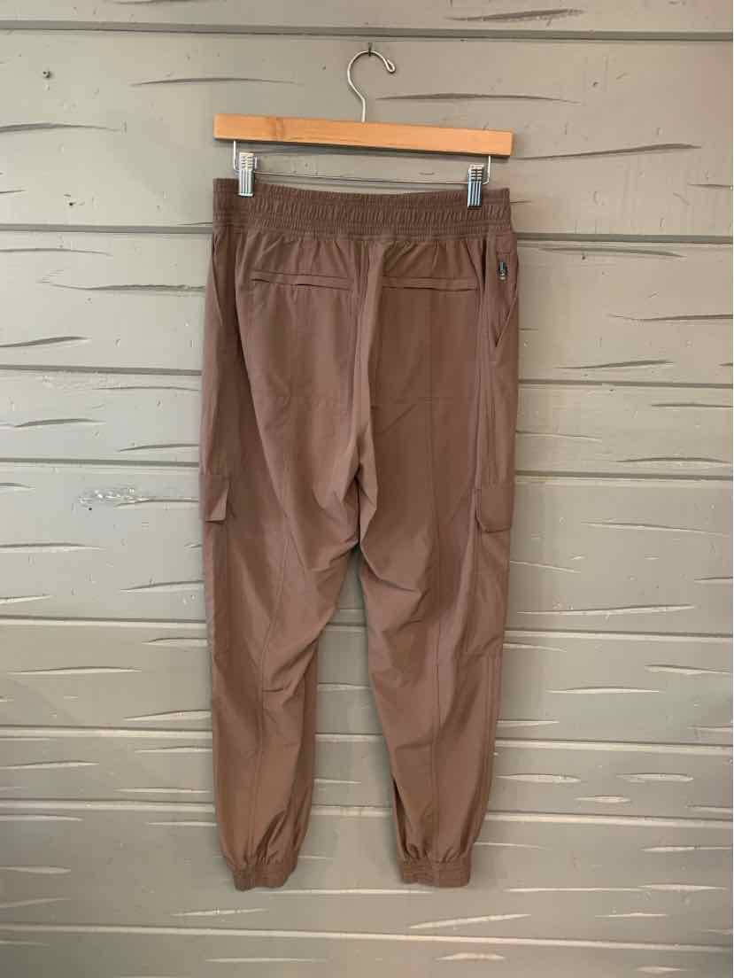 Brown athletic jogger pants with elastic waistband and cuffs, side pockets, size 6.