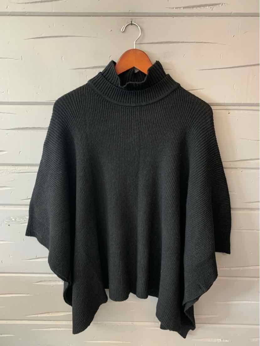 Black BCBG knit poncho with a high neck, loose draped fit, and pointed hem.