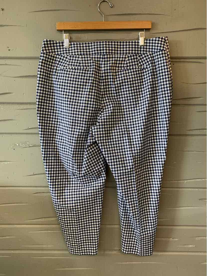 Black and white gingham check cropped pants with button and zipper closure.
