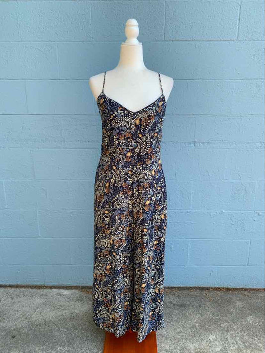 Floral print spaghetti strap midi dress with navy and brown tones on mannequin.