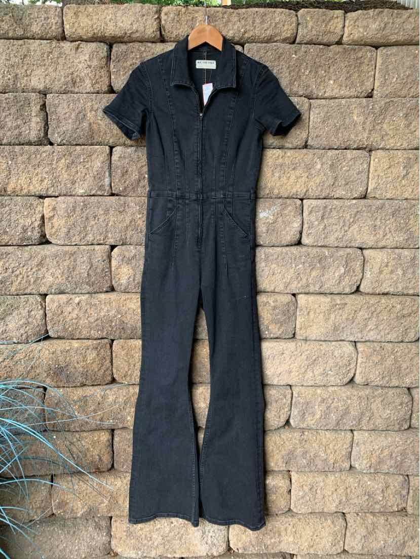 Black denim jumpsuit with short sleeves, collar, front zipper, and flared legs in size small.