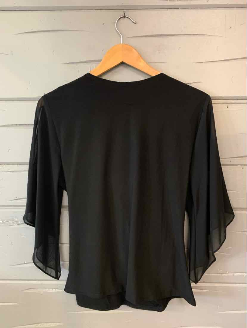 Black women’s long-sleeve top with sheer, flowing bell sleeves and a solid opaque bodice.