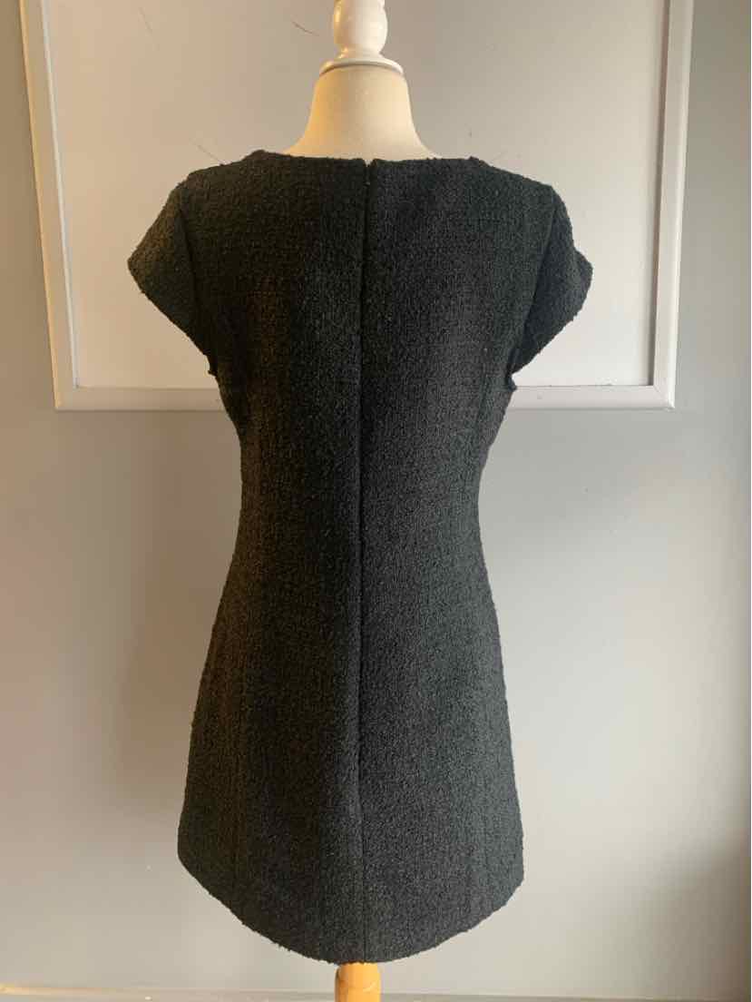 Black tweed short-sleeve fitted dress with back seam detail on mannequin.