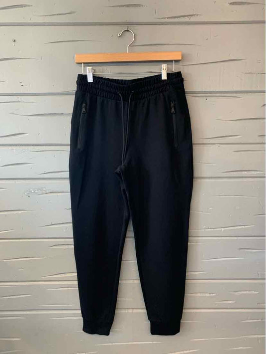 Black Old Navy jogger pants with an elastic drawstring waist, side pockets, and tapered cuffs.