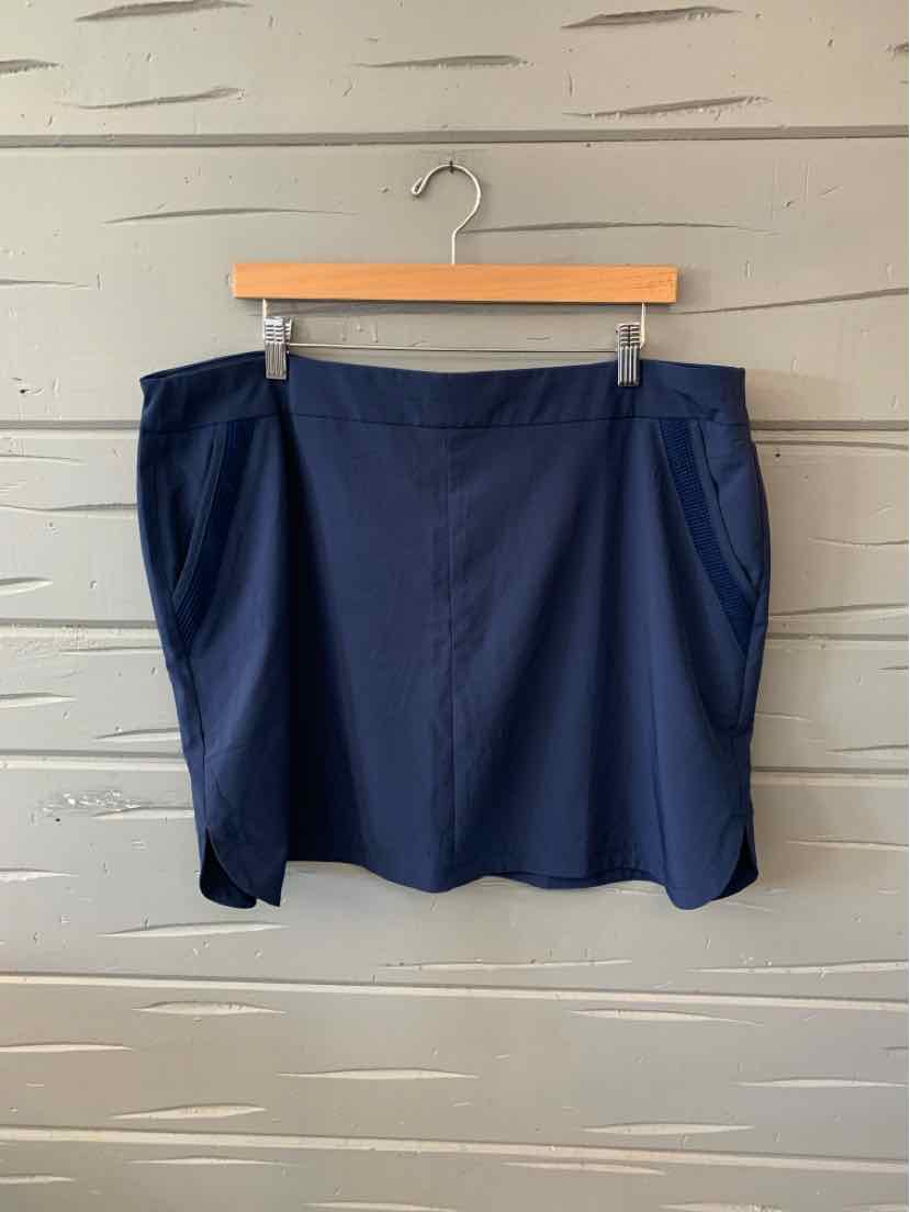 Navy blue skort with side pockets, smooth fabric, and a slight A-line shape in size XL.