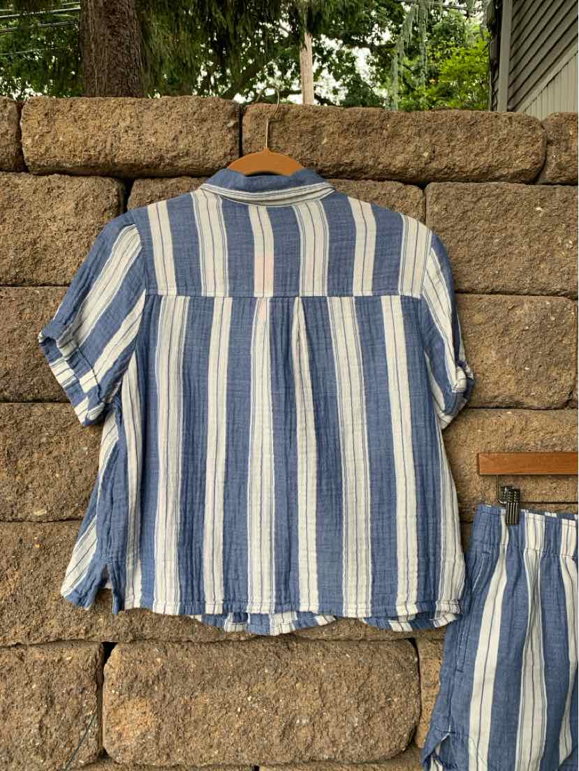 Blue and white vertical striped short-sleeve button-up shirt with a boxy fit.