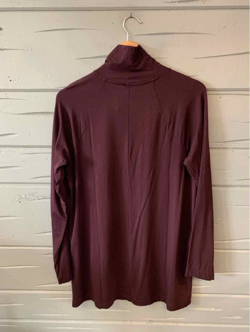 Burgundy long-sleeve turtleneck shirt with relaxed fit and smooth fabric.