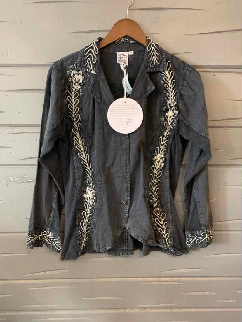 Black medium jacket with intricate cream embroidered floral patterns on collar, front edges, and cuffs hanging on wooden.