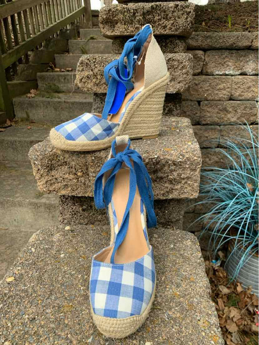Blue and white gingham wedge espadrille sandals with ankle ties and woven jute soles.