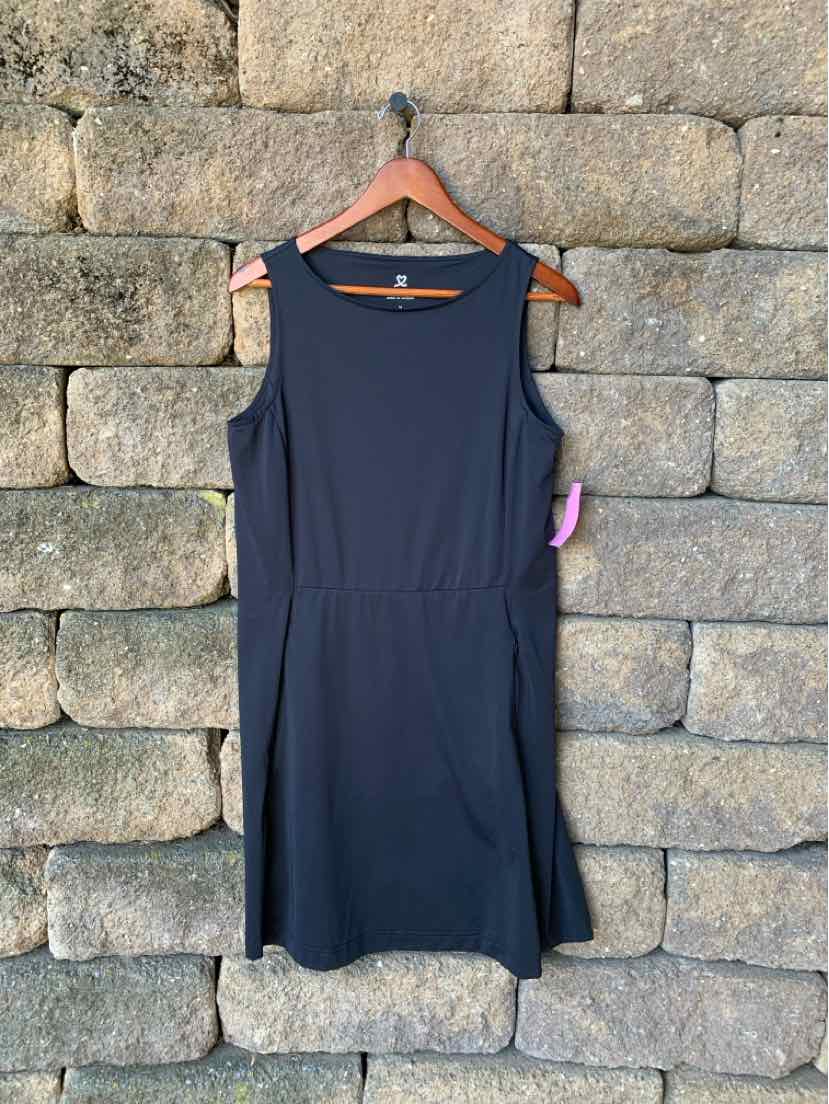Black sleeveless sports dress with round neckline and fitted waist, mid-thigh length.