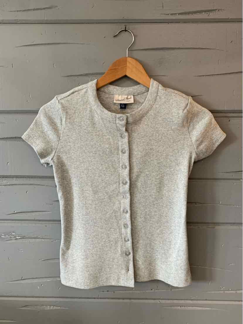 Light gray short-sleeve knit cardigan with front button closure and crew neckline on wooden hanger.