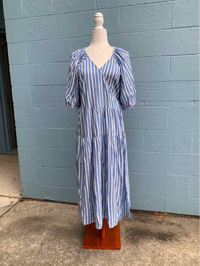 Blue and white vertical striped midi dress with V-neck and puffed elbow-length sleeves.