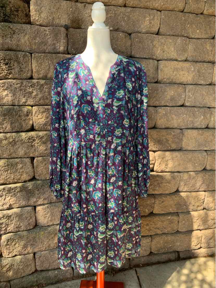 Multicolor floral print midi dress with long sleeves and button-front design on mannequin.