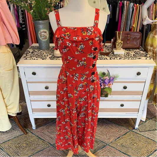 Red midi dress with white and yellow floral print, square neckline, and wide shoulder straps.