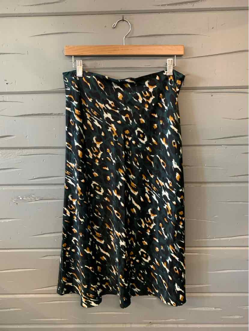 Teal satin midi skirt with black and beige leopard print pattern in flowy silhouette.
