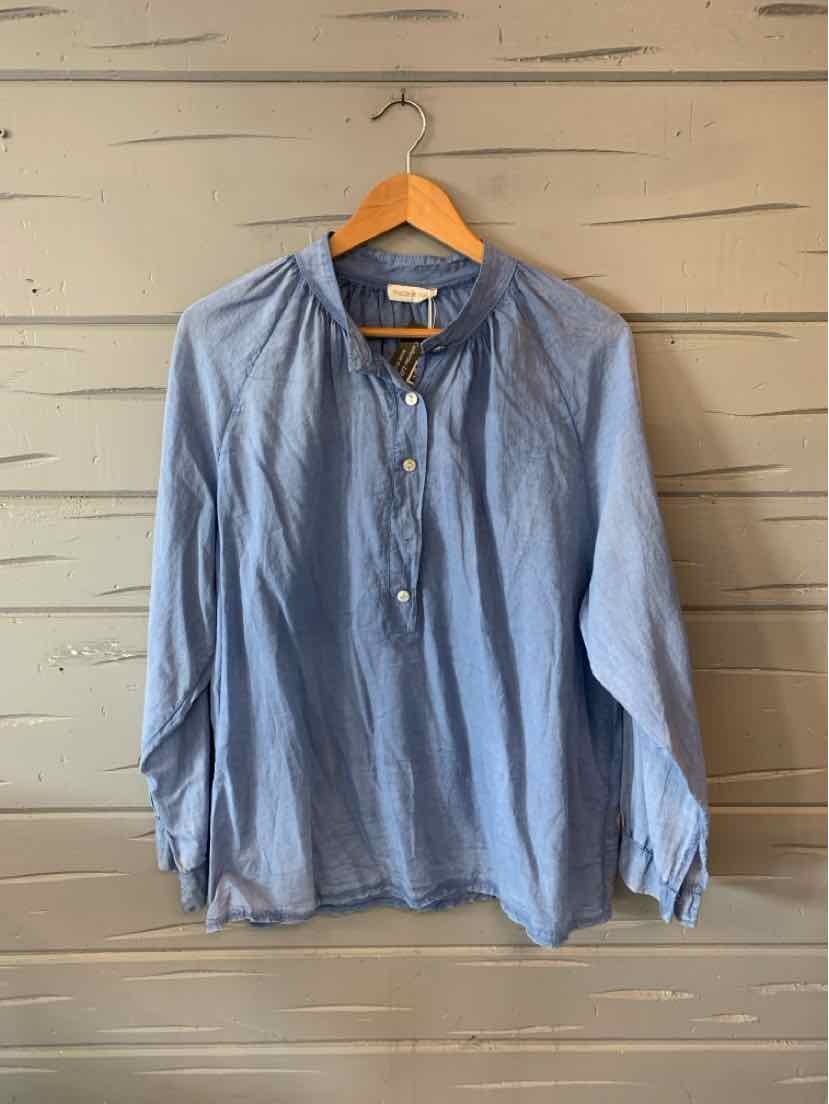 Light blue long-sleeve button-up shirt with round collar and gathered yoke, medium size.