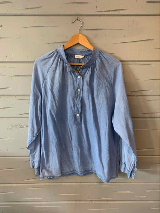 Light blue long-sleeve button-up shirt with round collar and gathered yoke, medium size.