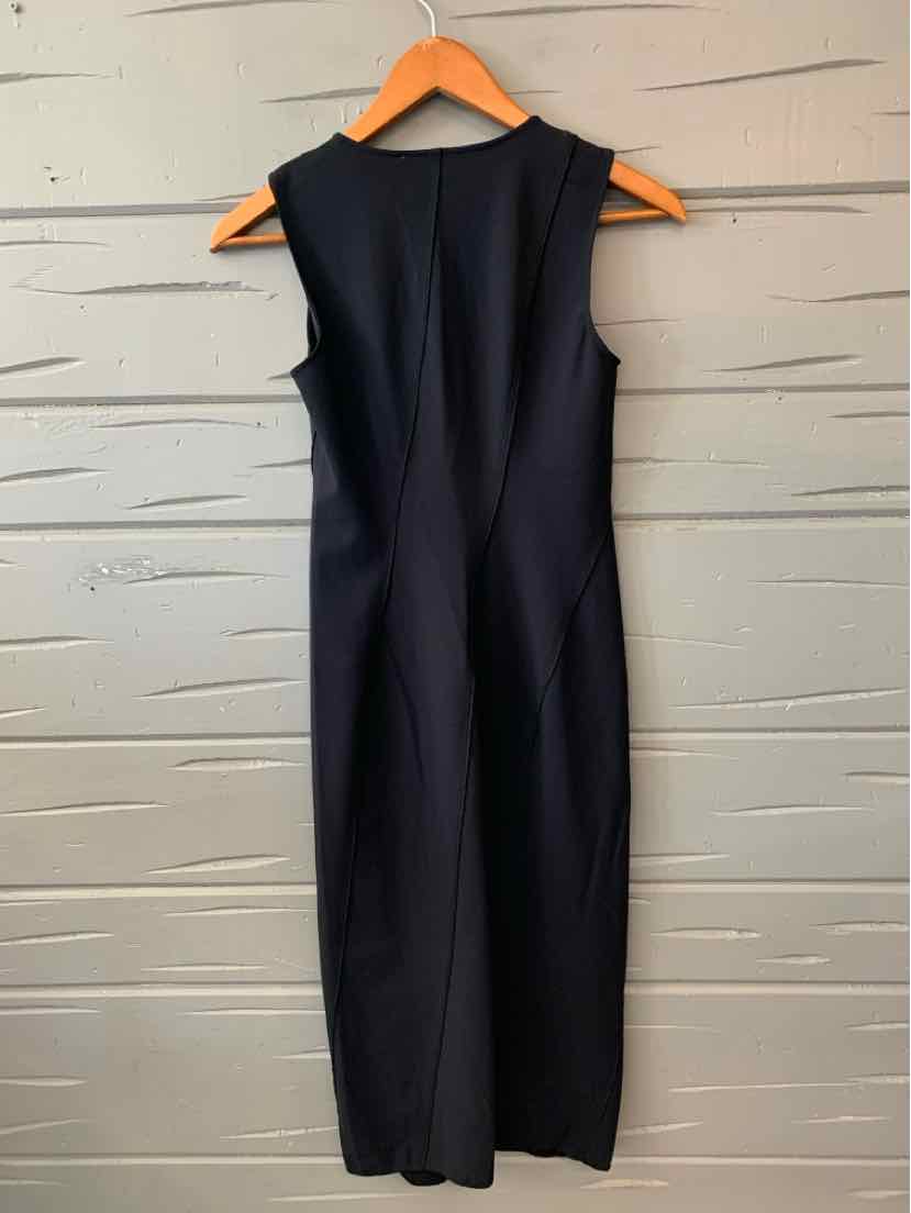 Black sleeveless midi dress with tailored fit and subtle back seam details on wooden hanger.