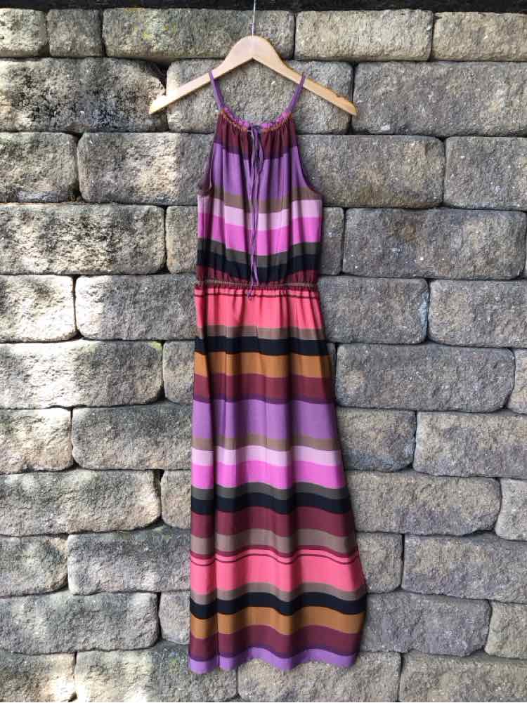 Sleeveless color block maxi dress in shades of purple, pink, orange, and black with cinched waist.