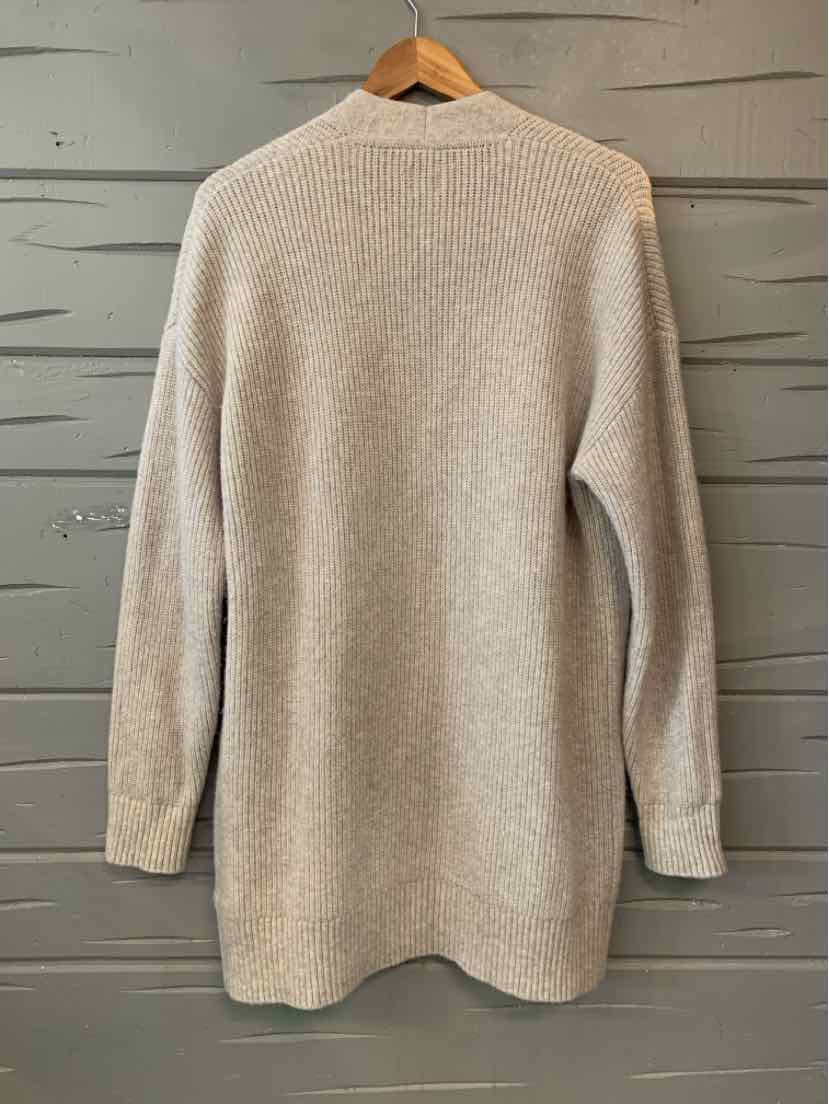 Beige GAP knit sweater with a simple solid design, long sleeves, and a rounded neckline.