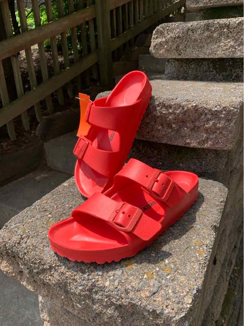 Bright red Birkenstock sandals with two adjustable straps and a contoured cork footbed, size 39.