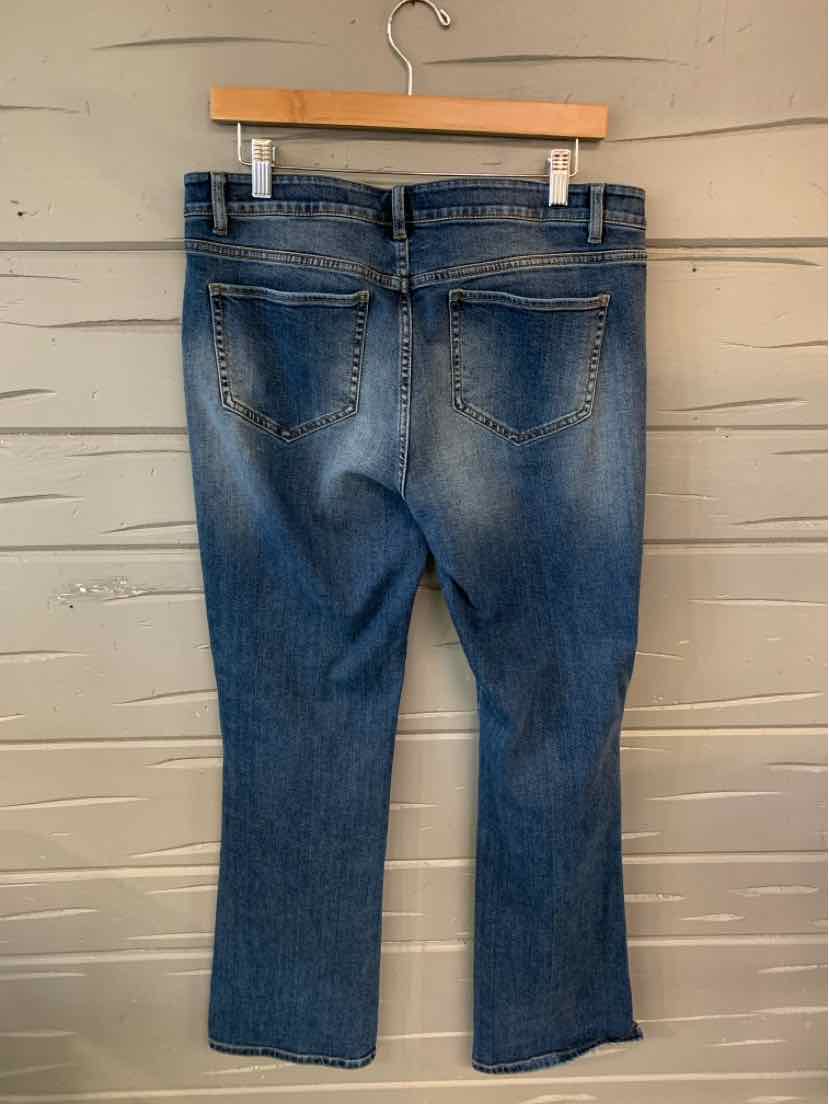Blue denim jeans size 10 with straight legs and classic back pockets hanging on wooden hanger.