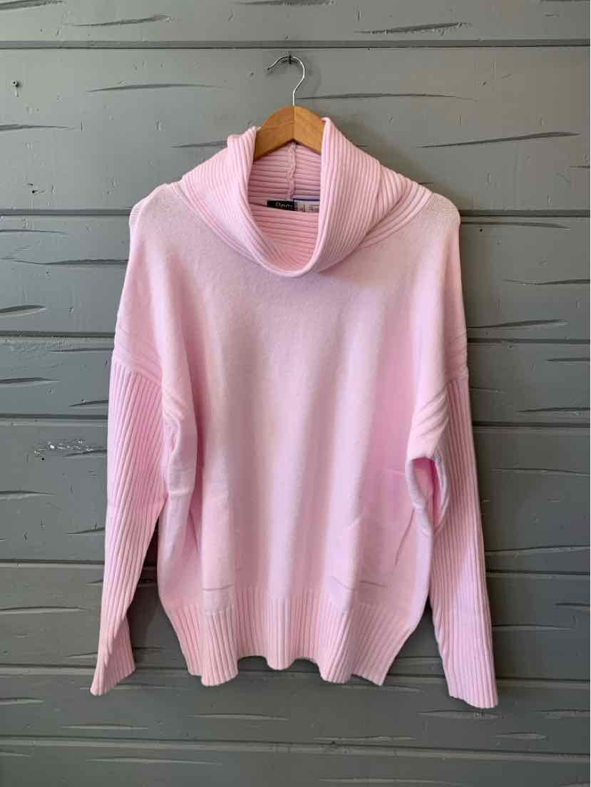 Light pink knit hoodie with a soft cowl neck, long sleeves, ribbed cuffs and hem, and a front kangaroo pocket.